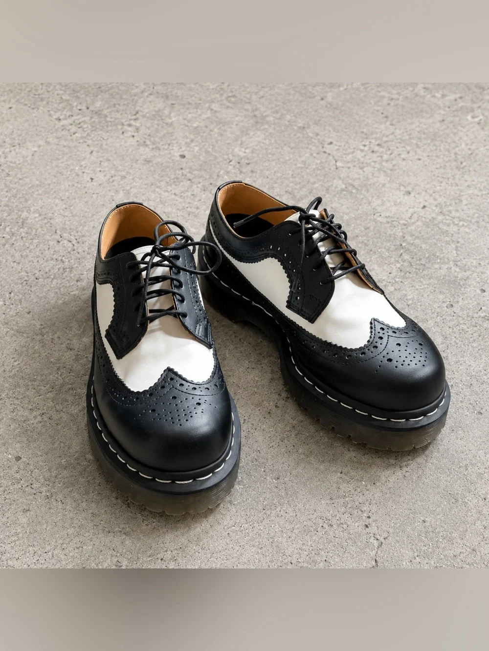 Dr. Martens Black & White Brogue Saddle Oxfords